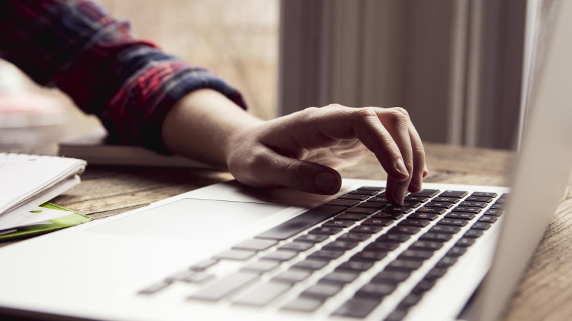 Close up teenage girl using laptop computer