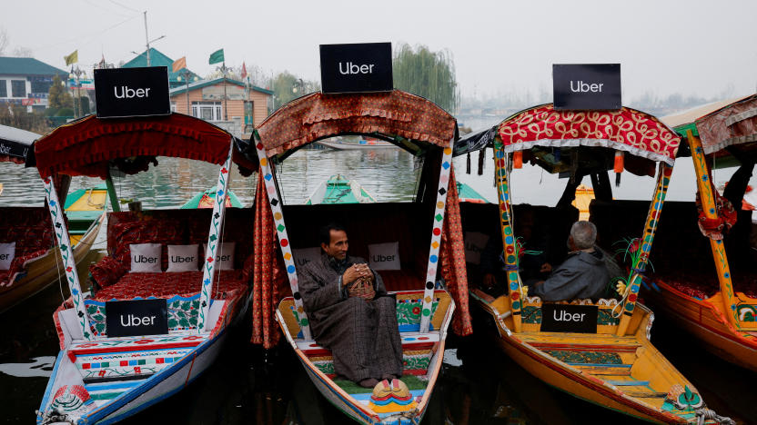 Uber signs are displayed on "Shikaras" or small boats after Uber launched its first water transport service on the waters of Dal Lake, one of Kashmir's main tourist attractions, in Srinagar, December 2, 2024. REUTERS/Sharafat Ali