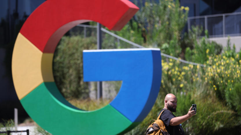 MOUNTAIN VIEW, CALIFORNIA - AUGUST 13: A visitor takes a selfie in front of a Google logo displayed in front company headquarters during the Made By Google event on August 13, 2024 in Mountain View, California. Google announced new Pixel phones, watches and AI features at the event. (Photo by Justin Sullivan/Getty Images)