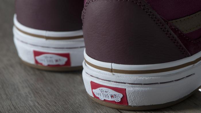 Shanghai, China - August 5, 2016: New Vans Shoes Box. Vans ("Off the Wall") brand low-top canvas sneakers original shoes. The sneakers are on a wooden background.