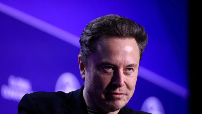 FILE PHOTO: Elon Musk, chief executive officer of SpaceX and Tesla and owner of X looks on during the Milken Conference 2024 Global Conference Sessions at The Beverly Hilton in Beverly Hills, California, U.S., May 6, 2024.  REUTERS/David Swanson/File Photo/File Photo