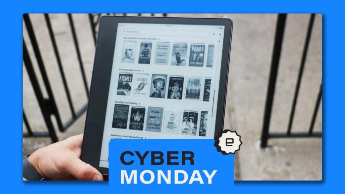 Amazon's Kindle Scribe pictured in a person's hand with a blue Cyber Monday banner in front of it