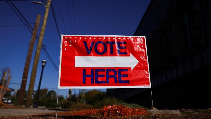 FILE PHOTO: A sign sits outside of a polling location as the battleground state opened for early voting, in Atlanta, Georgia, U.S., October 23, 2024. REUTERS/Hannah McKay/File Photo