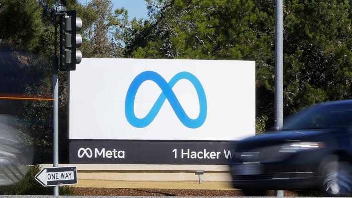 FILE - A car passes Facebook's new Meta logo on a sign at the company headquarters on Oct. 28, 2021, in Menlo Park, Calif. Big tech platforms say they are working hard to address misinformation about voting and elections ahead of the November 2022 midterms, but a look at their sites shows they are still struggling to contend with false claims from 2020. (AP Photo/Tony Avelar, File)