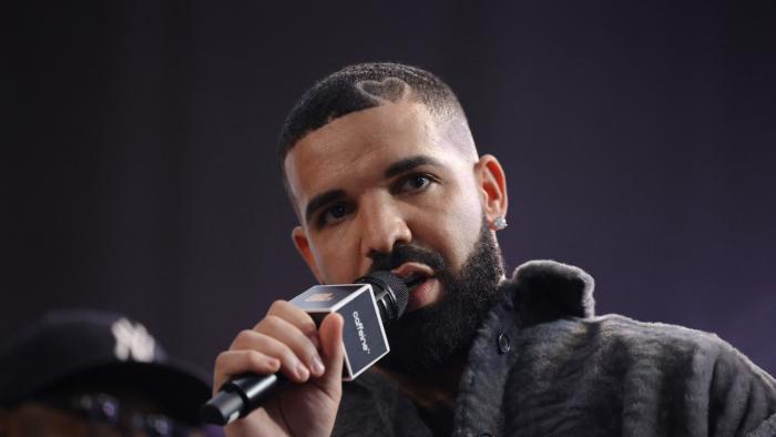 LONG BEACH, CALIFORNIA - OCTOBER 30: Drake speaks  onstage during Drake's Till Death Do Us Part rap battle on October 30, 2021 in Long Beach, California. (Photo by Amy Sussman/Getty Images)