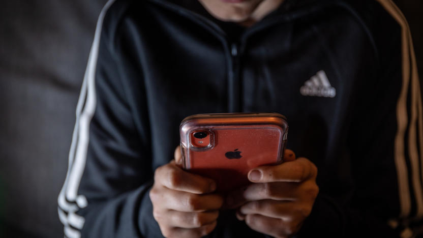 BATH, UNITED KINGDOM - MARCH 16: A 12-year-old boy looks at a smartphone screen on March 16, 2023 in Bath, England. Following the lead of the EU Commission and several US administrations, TikTok is set to be banned from UK government phones amid security concerns around the Chinese-owned video app. Recently TikTok announced that every account belonging to a user below age 18 have a 60-minute daily screen time limit automatically set. (Photo by Matt Cardy/Getty Images)