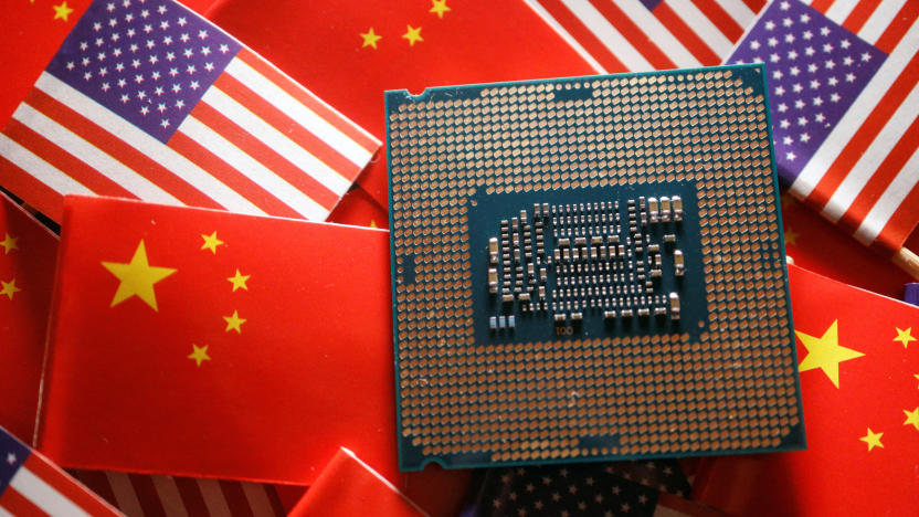 FILE PHOTO: A central processing unit (CPU) semiconductor chip is displayed among flags of China and U.S., in this illustration picture taken February 17, 2023. REUTERS/Florence Lo/Illustration/File Photo